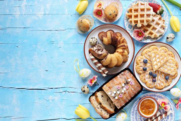 istock Easter festive dessert table with various of cakes, waffles and sweets. 1203535274