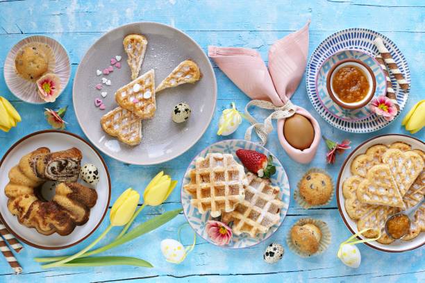 istock Easter festive dessert table with various of cakes, waffles and sweets. 1203535286