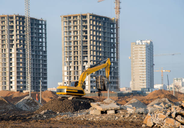 istock Excavator with crusher bucket for crushing concrete 1203535372