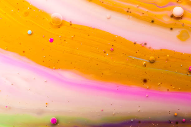 istock Macro universe, platnets and stars in it, multi-colored paints. 1203536124