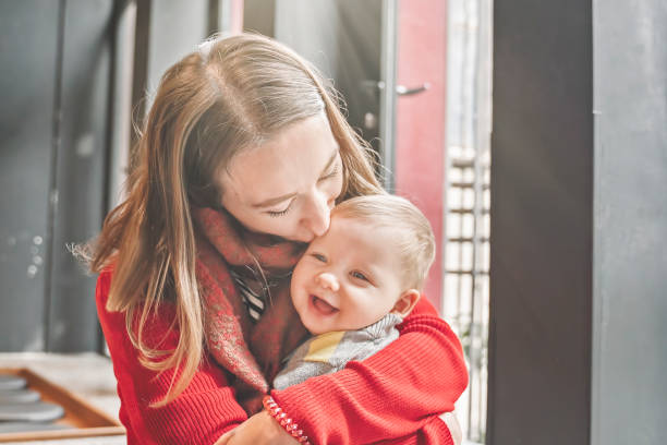 istock Mother embracing her son in arms 1203536711