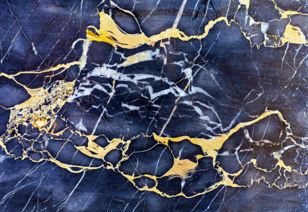 Golden Marble Tile Golden Veins in Dark Marble Stone Luxury veining stock pictures, royalty-free photos & images