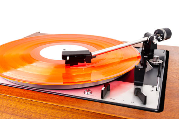istock Vintage turntable with a red vinyl isolated on white 1203537912