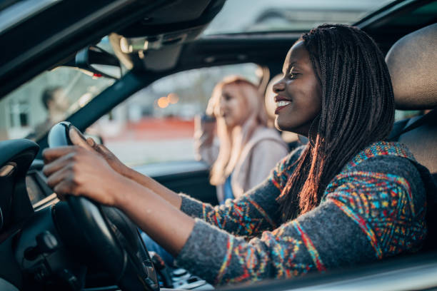 istock Two women driving in a car 1203539425