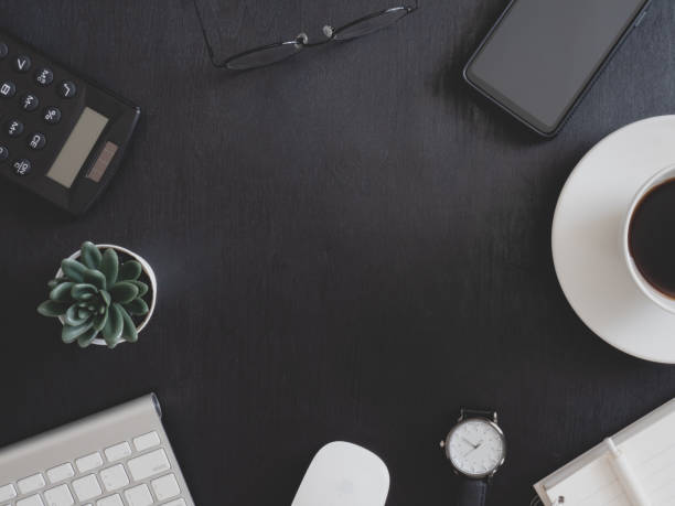 istock top view of office desk table with coffee cup and notebook on white background, graphic designer, Creative Designer concept. 1203540780