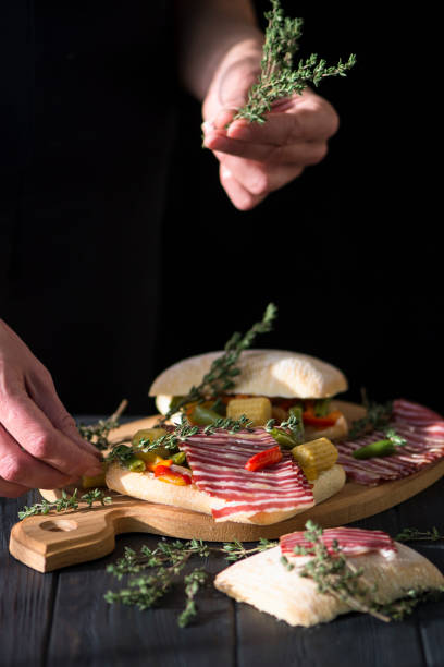sandwich with grilled vegetables, meat and rosemary