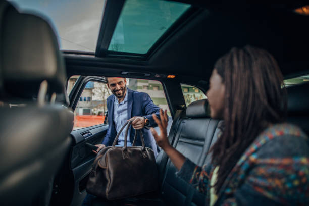 istock Businessman entering a car 1203541144