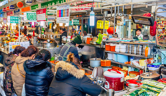 The pic shows The famous Gwangjang Market in Seoul, South Korea. Street food vendors selling korean street food. The pic is taken in november 2019 in seoul.