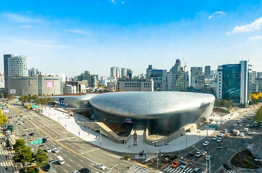 This  pic shows Aerial View of Dongdaemun Design Plaza in Seoul South Korea. The pic is taken from high and traffic on the road can be seen along with design plaza. The pic is taken in day time and in november 2019 in seoul.