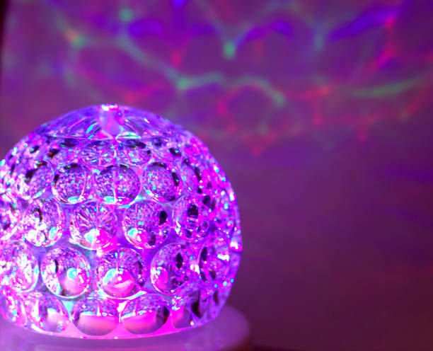 istock disco dancing light ball in purple and pink colors. 1203544980