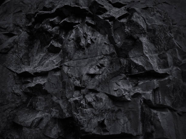 istock Black grunge background. Black and white background. Mountain texture close-up. 1203546945