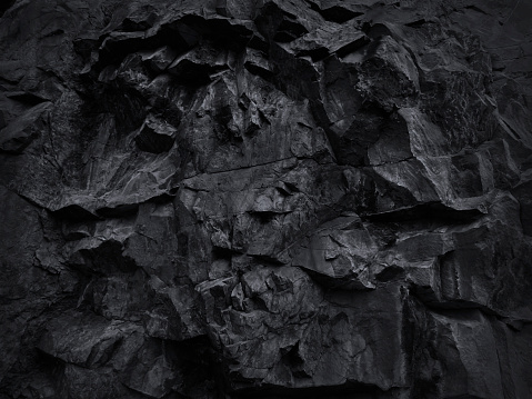 Volumetric rock texture. 3D effect. Black stone background for your design.