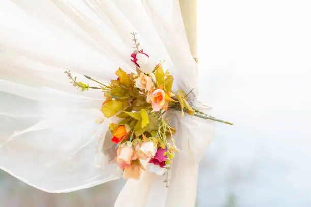 Wedding bouquet On the bamboo  with white cloth