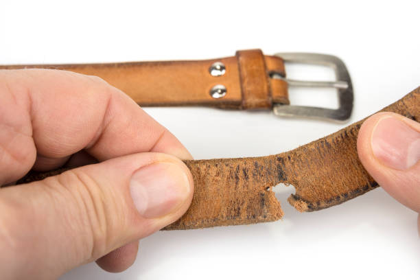 istock old worn out leather belt on a white 1203548929