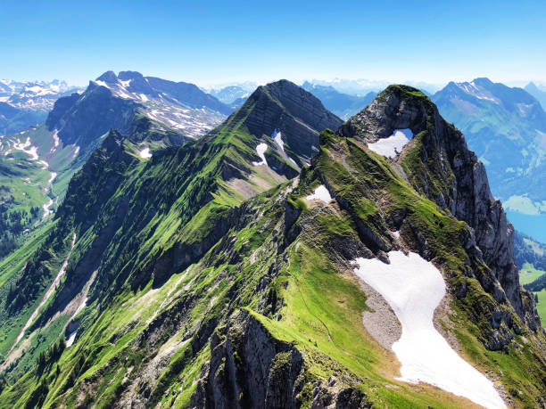 istock Rossalpelispitz or Rossaelplispitz and Zindlenspitz Mountains above the alpine Lake Wagitalersee (Waegitalersee), Innerthal - Canton of Schwyz, Switzerland 1203549460