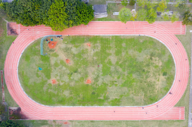 вид с воздуха на игровую площадку - school sport high up long jump стоковые фото и изображения