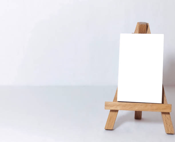 istock Easel for artists and blank canvas miniature 1203550473