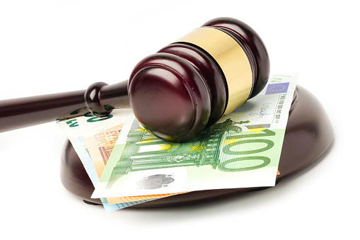 Gavel for judge lawyer on Euro banknotes background.