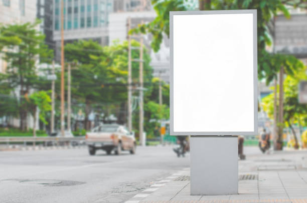 istock led blank billboard white screen side road in city. ad mockup copy space for advertising banner near bus stop in metropolis. 1203551211