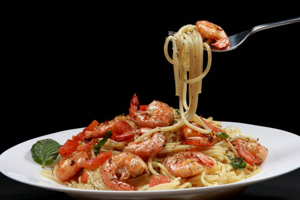 istock Fresh fried Prawns or Shrimps on a Spaghetti Pasta Plate 1203551949