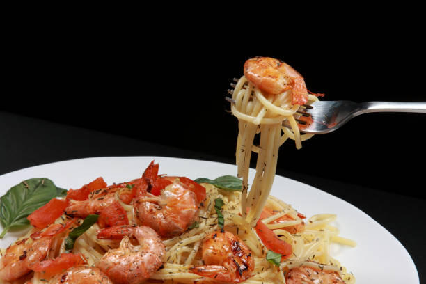 istock Fresh fried Prawns or Shrimps on a Spaghetti Pasta Plate 1203551953