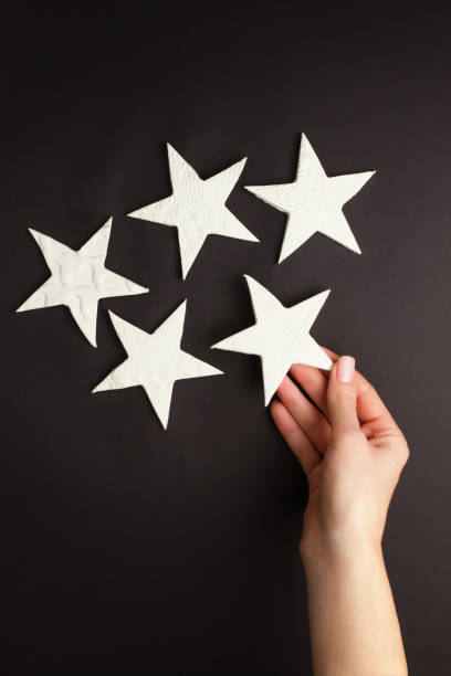 istock Hands holding little stars 1203552175