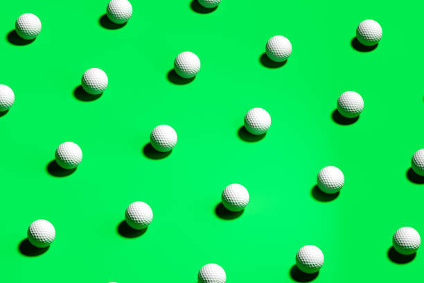 istock Golf Balls Isolated On Green Background. 3d Rendering 1203553920