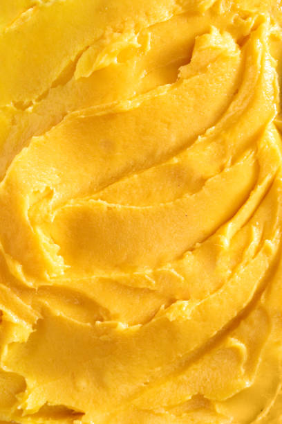 istock Top view of soft mango sorbet surface 1203556988