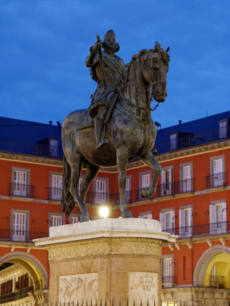 istock Felipe III Statue in plaza mayor in Madrid at dawn or twilight perspective view 1203557526