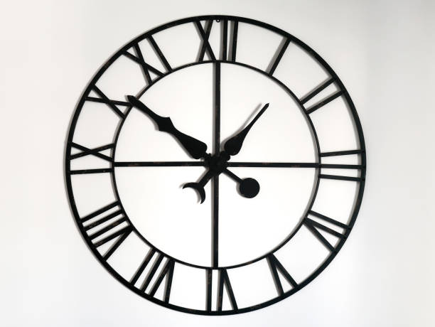 istock Big vintage wall clock with roman numbers 1203557719