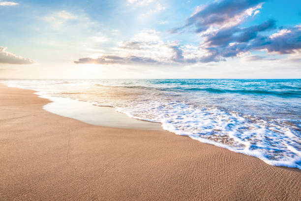 istock Beautiful cloudscape over the sea waves, sunrise 1203559772