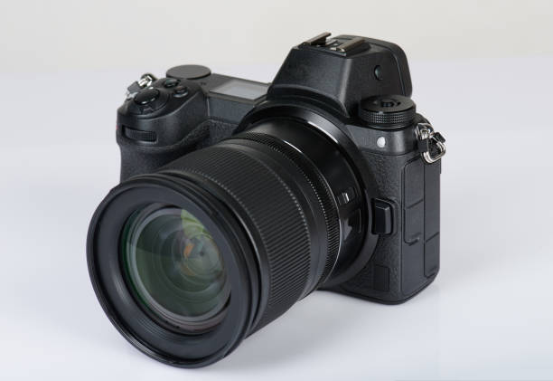 Modern mirrorless camera Modern mirrorless camera isolated on white background camera photographic equipment stock pictures, royalty-free photos & images