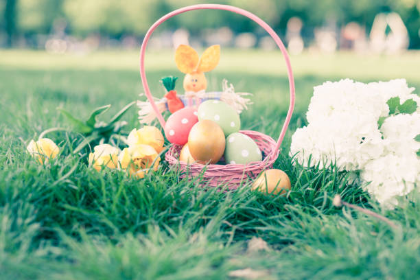 istock Easter eggs in basket in the grass with Hydrangea flower 1203562184