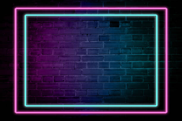 istock Lighting Effect frame pink and blue neon on brick wall for background party or your text. 1203563546