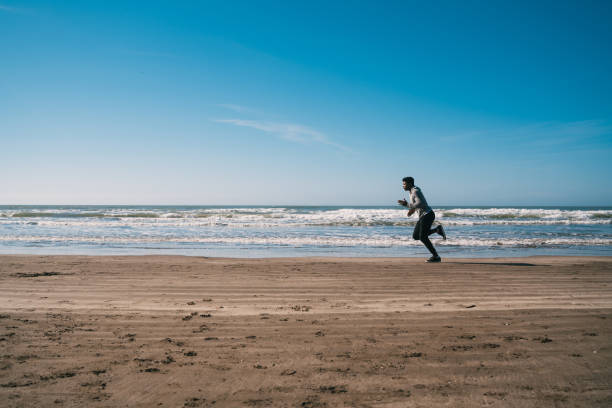 istock Portrait of an athletic man running. 1203563695