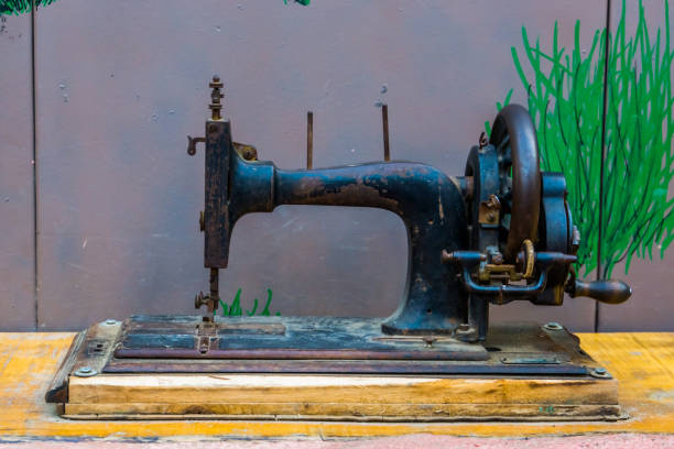 istock Metal sewing machine, Vintage equipment and hobby, Tailor background 1203564757