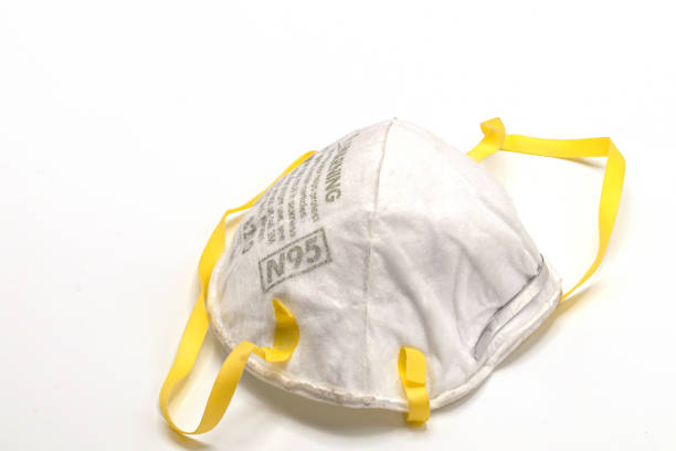 istock Old and dirty N95 face mask isolate on white background.Close up disposable face mask. 1203565015