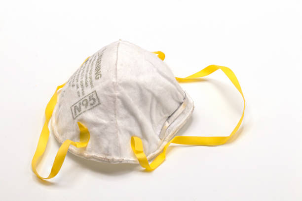 istock Old and dirty N95 face mask isolate on white background.Close up disposable face mask. 1203566834