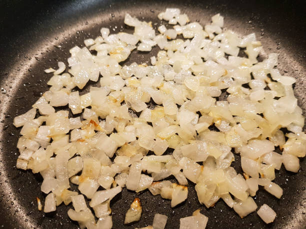 istock Golden fried onions in a pan 1203567642