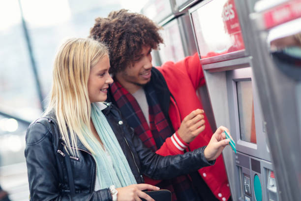 istock A young couple buying train tickets 1203568301