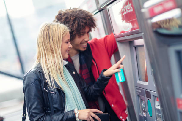 istock Buying train tickets at a ticket machine 1203569001