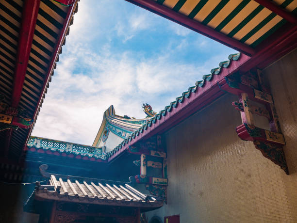 istock Chinese Temple Rooftop with blue sky 1203569086