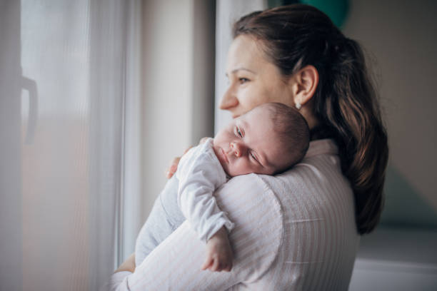 istock Mother with her newborn son 1203570565
