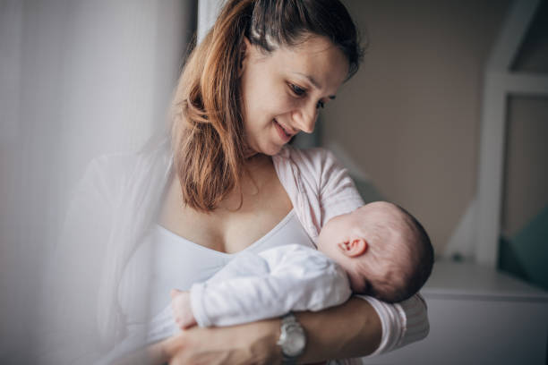 istock Mother with her newborn son 1203570587