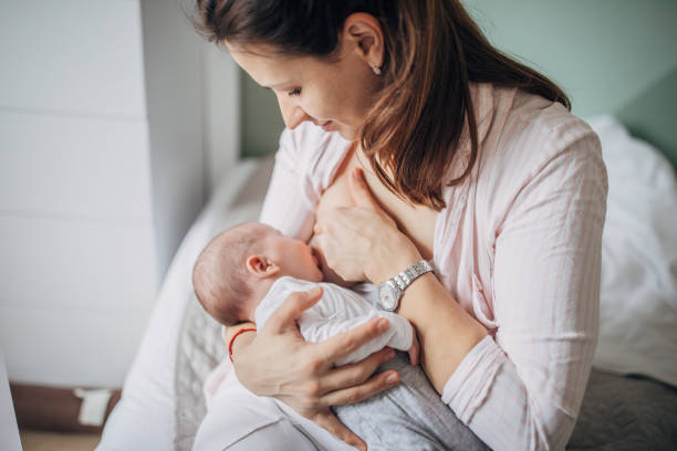 istock Mother breastfeeding baby boy 1203570664