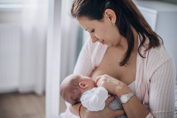 istock Mother breastfeeding baby 1203570731