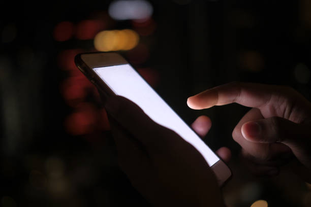 istock women hand using smart phone at night 1203570897