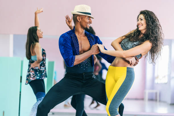 istock Men and women dancing salsa o bachata 1203571083
