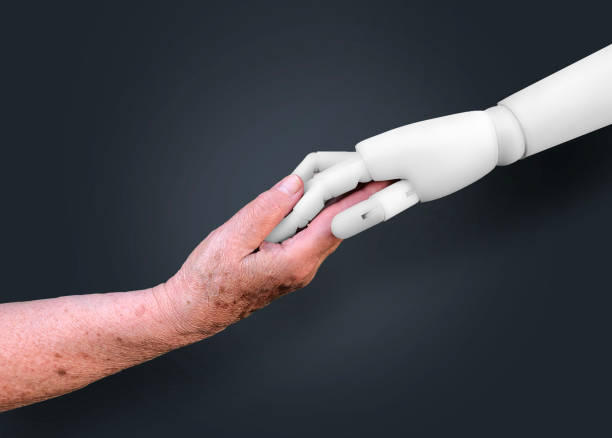 main de vieille femme retenant une main de robot - human hand old senior adult holding hands photos et images de collection