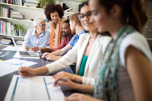 istock Successful group of business people at work in office 1203572252